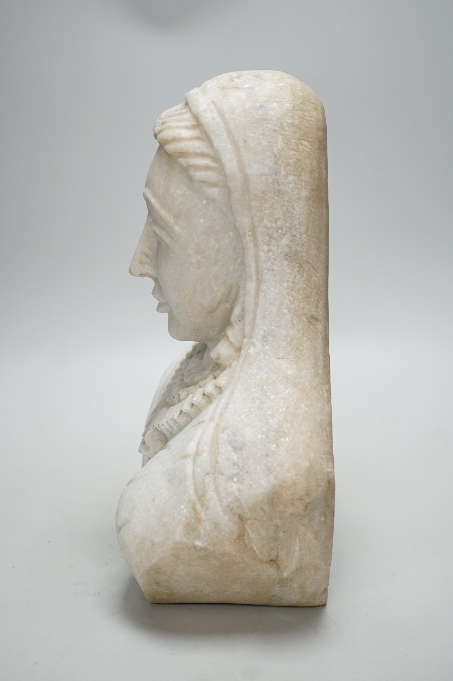An Indian carved marble bust, 31cm